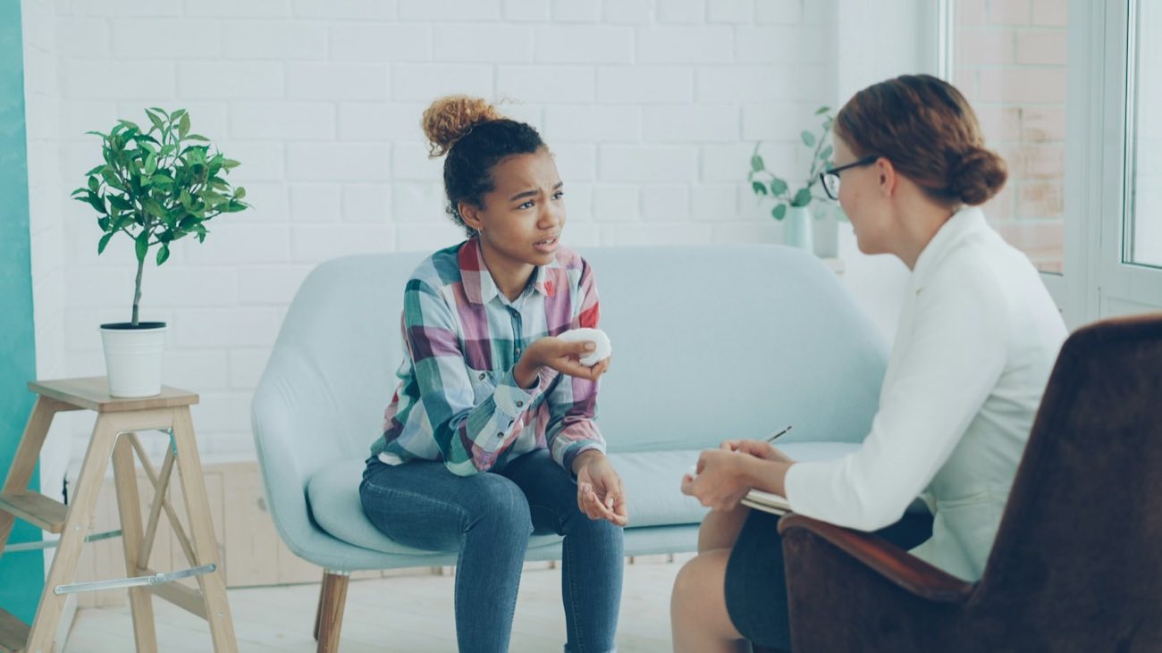 Young woman talking with a counselor