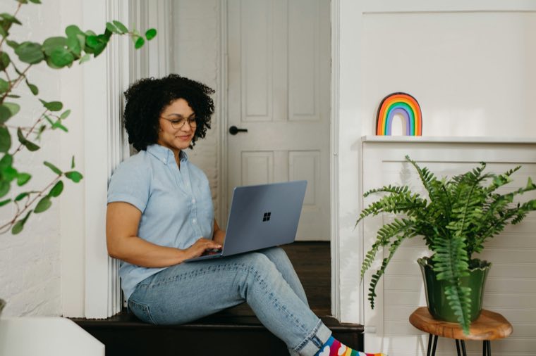 Woman with a laptop at home