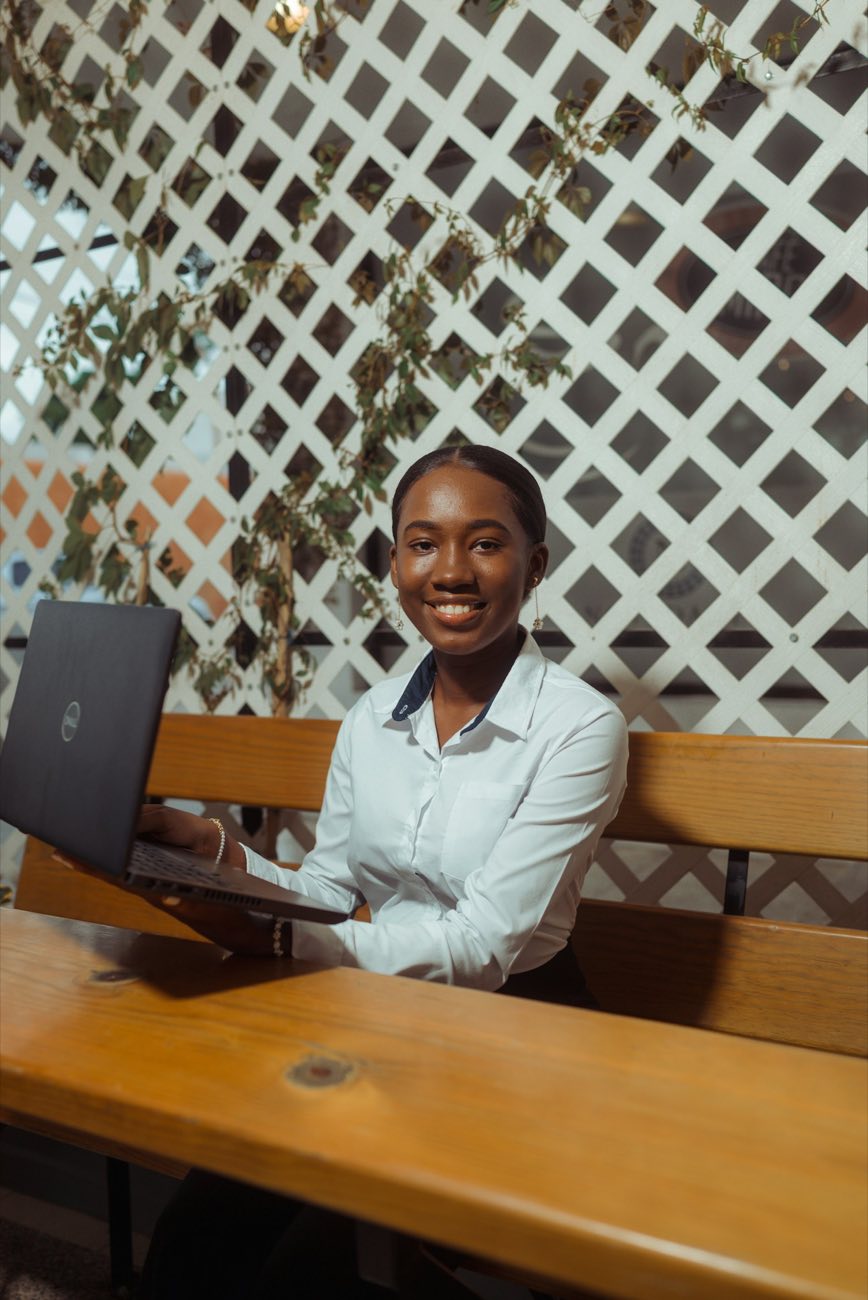 Young woman working on a laptop in an office