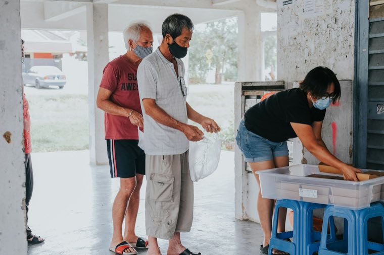 People at a food pantry counter