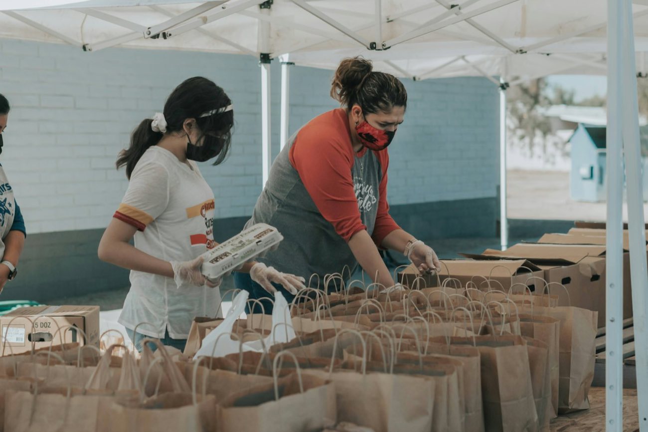 Volunteers packing grocery bags
