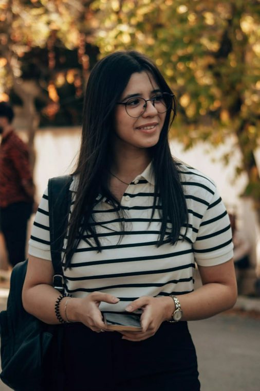 Smiling woman in glasses and a striped shirt