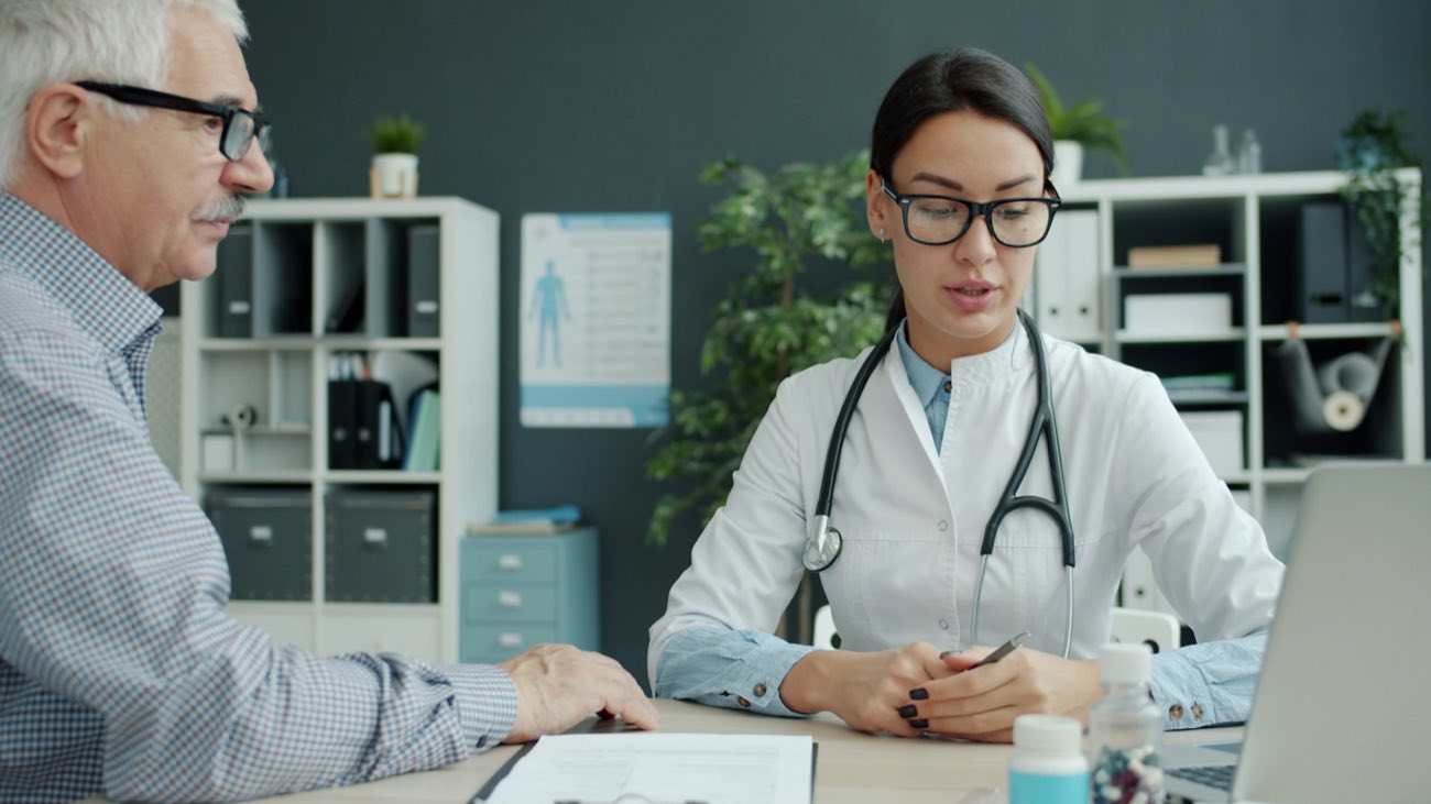 Doctor at a desk with a patient