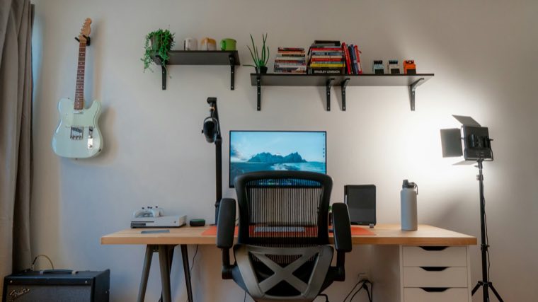 Small room with a desk and shelves
