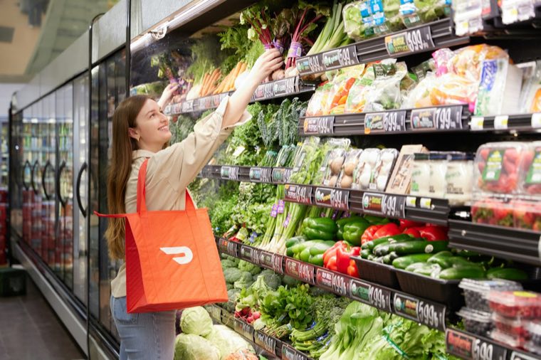 Woman choosing produce in a store