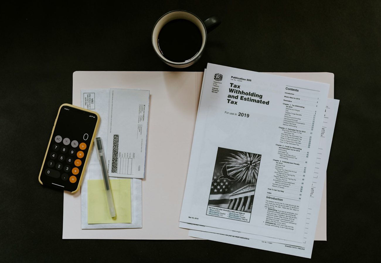 Forms, a calculator and a coffee