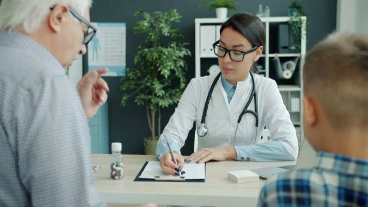 A doctor talking with a young patient